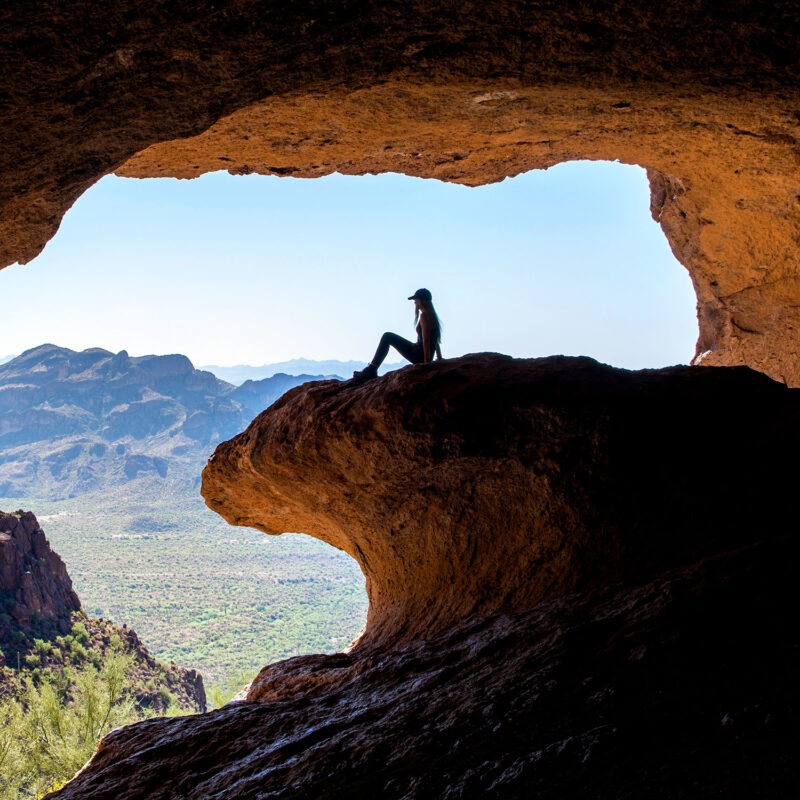 Woman sitting on rock formation in National Park